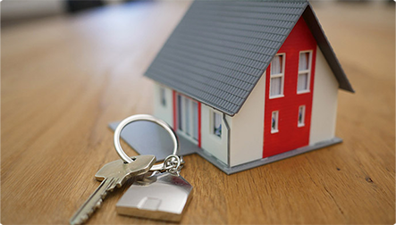 House held in hands with keys